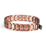 Bracelet magnétique en cuivre bronze pour homme avec maillons rectangulaires et aimants visibles.