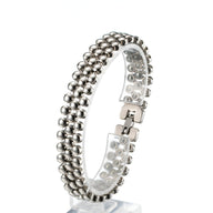 Bracelet magnétique homme en germanium argenté avec maillons ronds texturés et fermoir sécurisé.