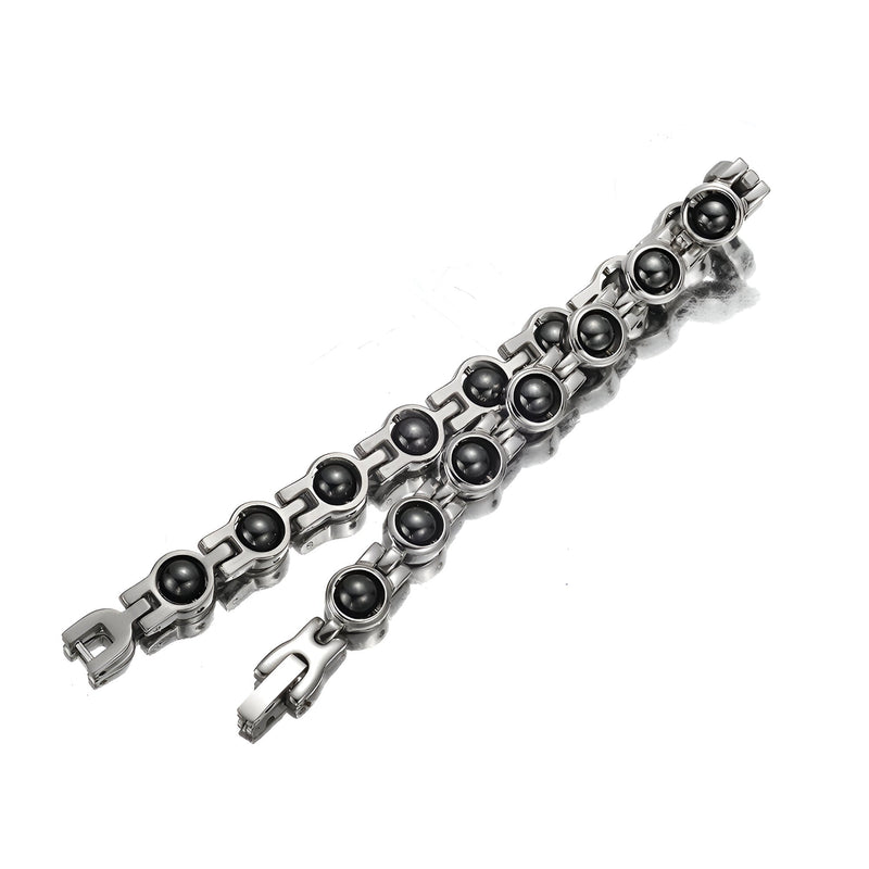 Bracelet magnétique femme en titane argenté avec billes et maillons arrondis modernes.