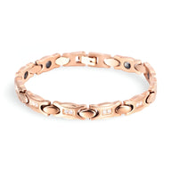 Bracelet magnétique en titane or rosé pour femme, design élégant avec maillons ovales et détails polis.