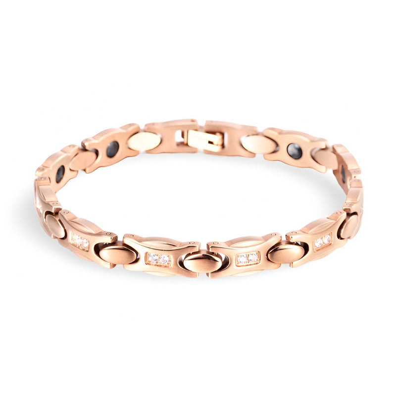 Bracelet magnétique en titane or rosé pour femme, design élégant avec maillons ovales et détails polis.