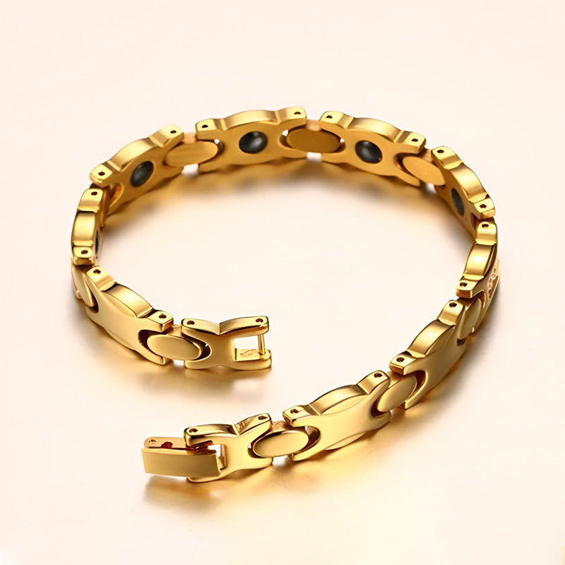 Bracelet magnétique en titane or avec maillons incurvés et fermoir élégant pour femme.
