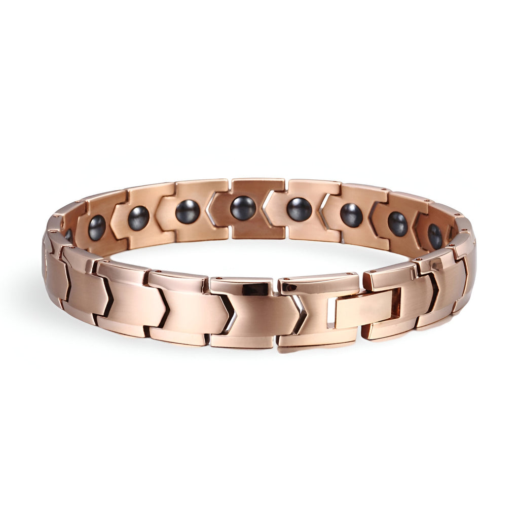 Bracelet magnétique homme en titane or rosé avec maillons larges et détails ronds noirs à l’intérieur.
