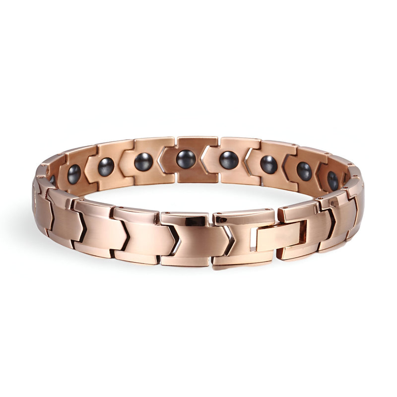 Bracelet magnétique homme en titane or rosé avec maillons larges et détails ronds noirs à l’intérieur.