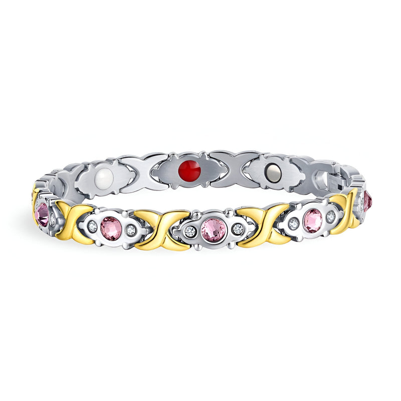 Bracelet magnétique femme en titane argenté et or, serti de zirconiums rose et rouge.