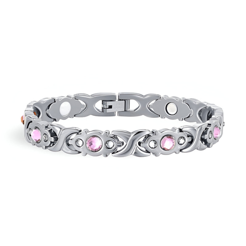 Bracelet magnétique en titane argenté orné de zirconiums roses ronds pour femme.
