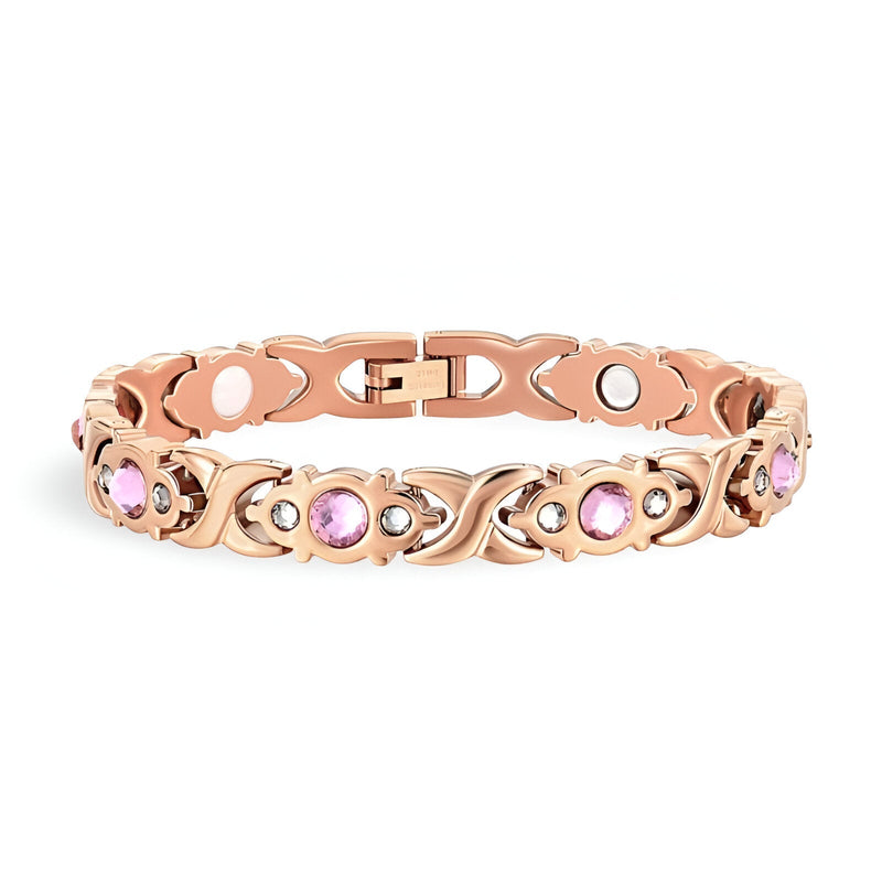 Bracelet magnétique en titane or rosé avec zirconiums roses sertis, style délicat pour femme.