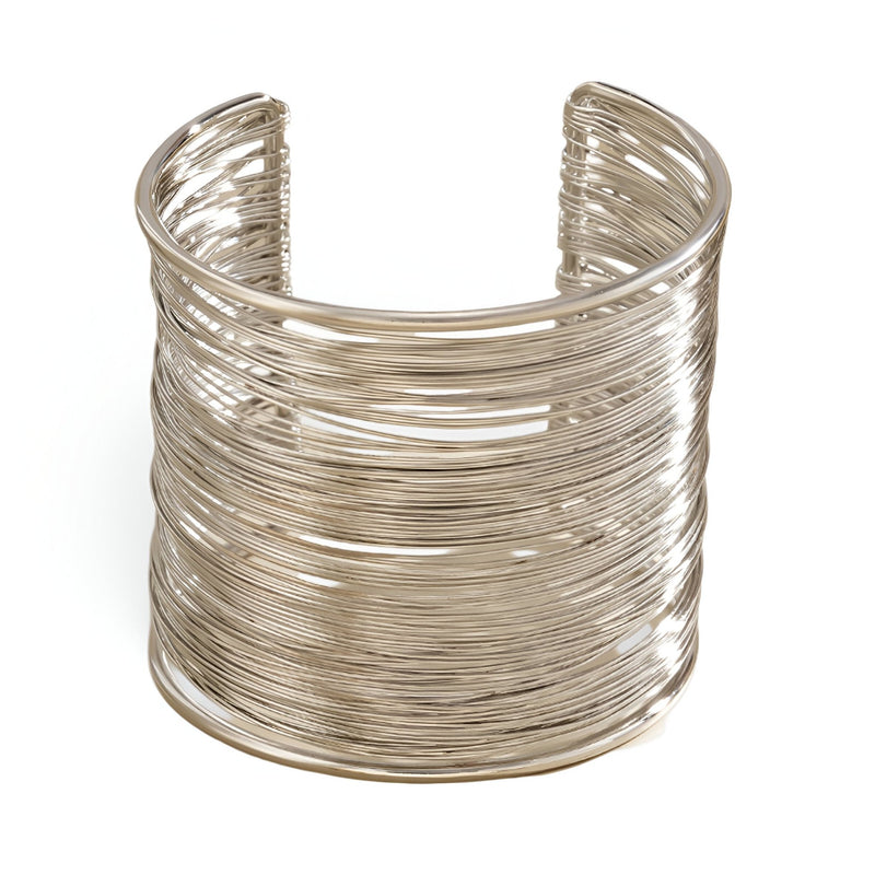 Bracelet manchette large en alliage métallique argenté à multiples fines branches entrelacées.