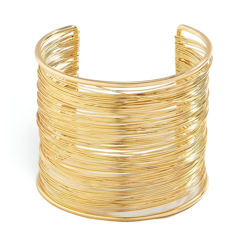 Bracelet manchette doré en alliage métallique avec multiples fines branches entrelacées.