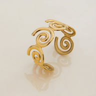 Bracelet manchette doré, design spirales, en acier inoxydable, modèle Olyra - La Boutique du Bracelet