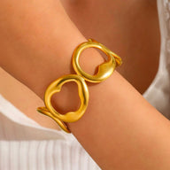 Bracelet manchette doré, style épuré, ovales irréguliers, en acier inoxydable, modèle Xalina - La Boutique du Bracelet