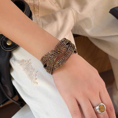 Bracciale manchette multi-filo con perle intrecciate, finitura bronzo anticato, da donna, modello Fadine