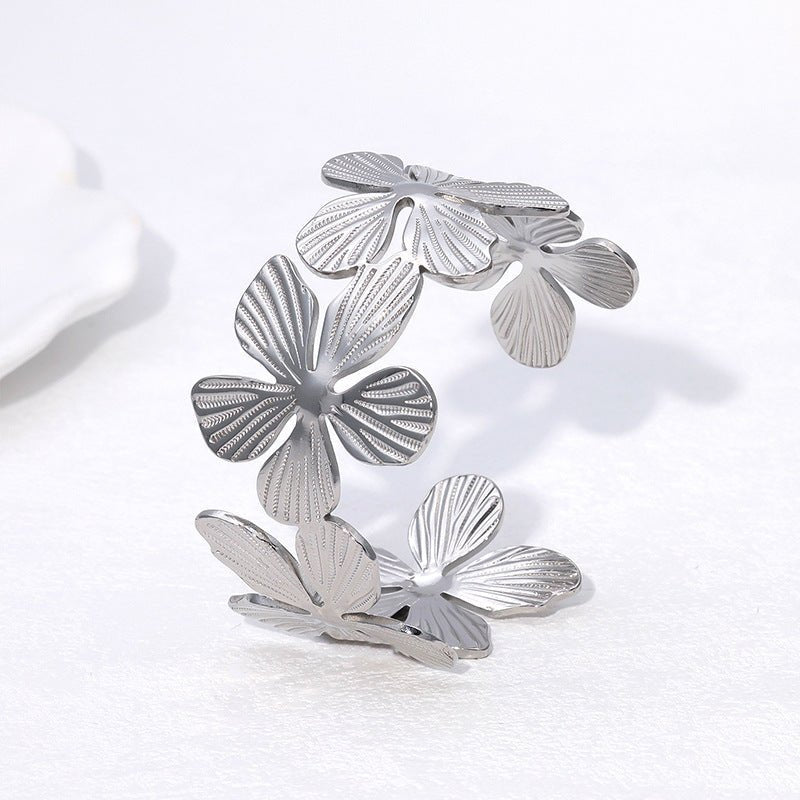 Bracelet manchette style ensoleillé, fleurs et pétales, en acier inoxydable, modèle Bina - La Boutique du Bracelet