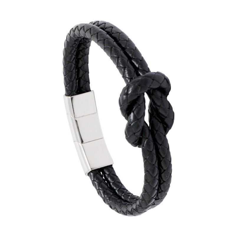 Bracelet masculin noir en simili cuir tressé avec nœud et fermoir magnétique en acier inoxydable brillant.