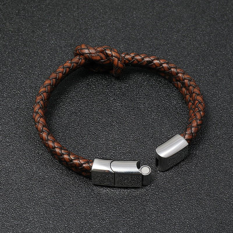 Bracelet masculin tressé en simili cuir marron avec fermeture magnétique en acier inoxydable zilver.
