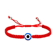 Bracelet en fil rouge ciré tressé avec pendentif œil bleu et blanc au centre, ajustable.
