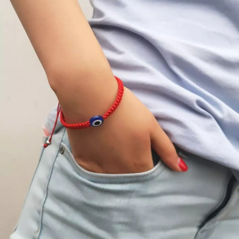 Bracelet fil rouge ciré avec pendentif œil bleu blanc noir, ajustable, style ethnique.