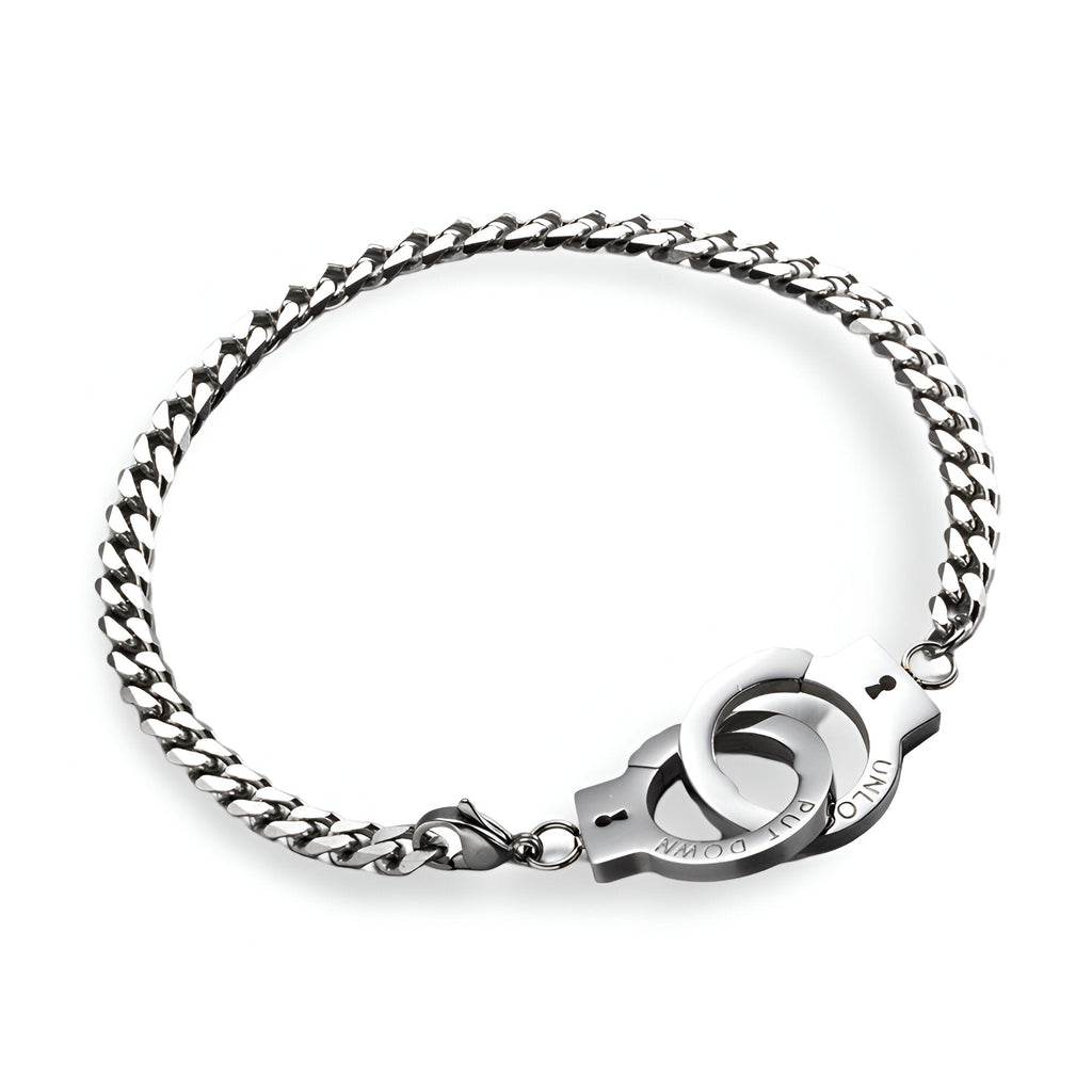 Bracelet menottes en acier inoxydable argenté avec maillons larges et fermoir menottes moderne.