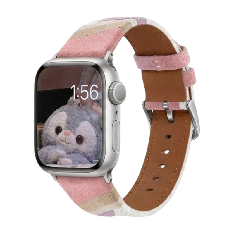 Bracelet Apple Watch en toile tissée rose à blanc, boucle argentée, intérieur cuir marron doux.