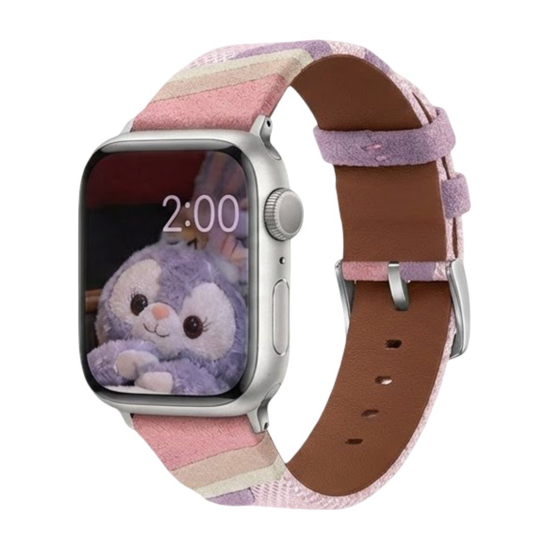 Bracelet Apple Watch en toile tissée rose et blanc, intérieur cuir marron doux, boucle argentée simple.