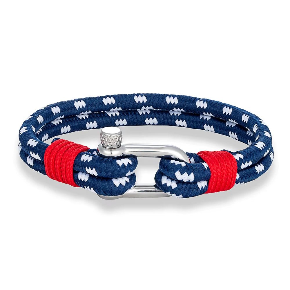 Bracelet marin en corde nautique bleu à motifs blancs avec fermoir mousqueton argenté et détails rouges.
