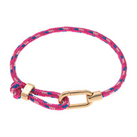 Bracelet ajustable en nylon rose et bleu avec mousqueton en acier inoxydable doré.