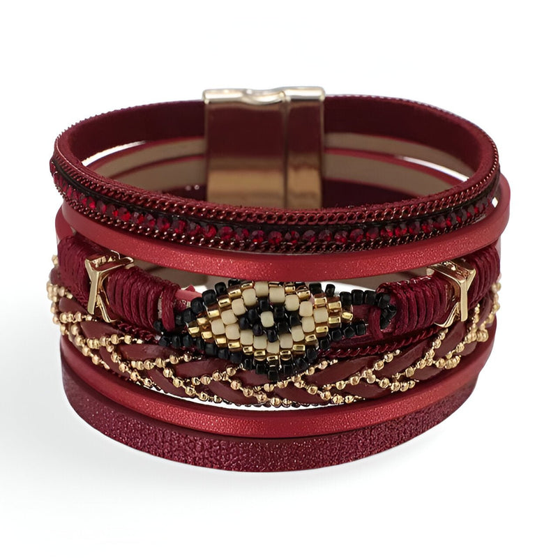 Bracelet multi-rangs rouge avec perles dorées et noires en motif œil, fermoir magnétique métal doré.