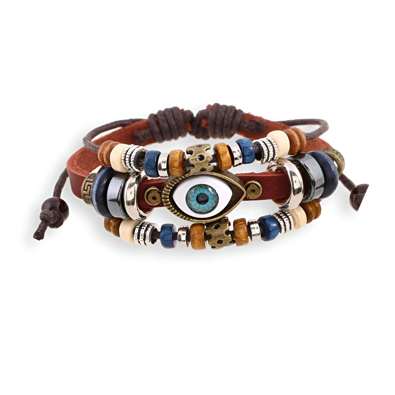 Bracelet multi-rangs en cuir marron avec perles blanches, noires et bleues, œil central bleu et liens ajustables.