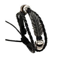 Bracelet multi-rangs noir en microfibre avec grande plume métallique et perles argentées.