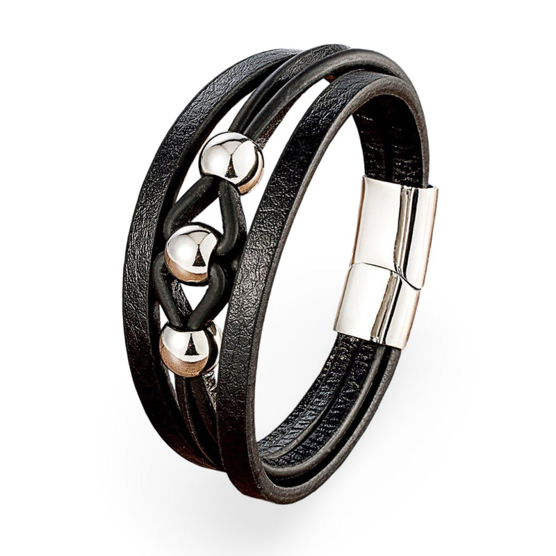 Bracelet multi-rangs noir en microfibre avec breloques métalliques argentées et fermoir magnétique.