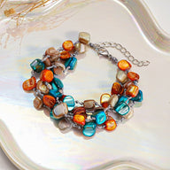 Bracelet multi - rangs, en titane et perles nacrées colorées, modèle Létunia - La Boutique du Bracelet