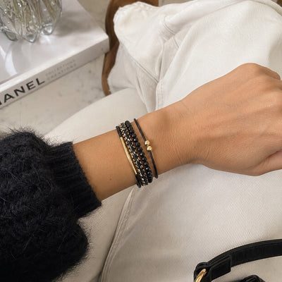 Bracciale multi-filo bohémien, perle sfaccettate e cordoncini intrecciati, chiusura magnetica dorata, per donna, modello Losiane