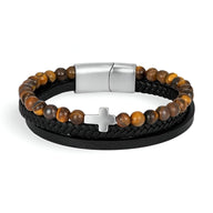 Bracelet multi-rangs homme avec perles œil de tigre, croix argentée et cuir noir tressé.