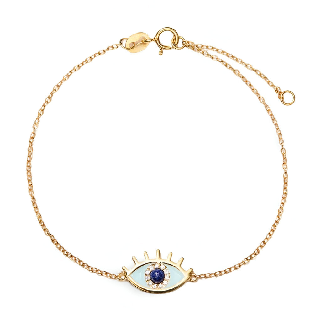 Bracelet en argent sterling doré avec pendentif œil bleu et cils stylisés.