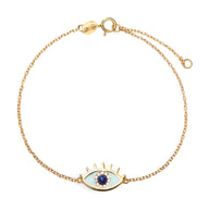 Bracelet en argent sterling doré avec pendentif œil bleu et cils stylisés.