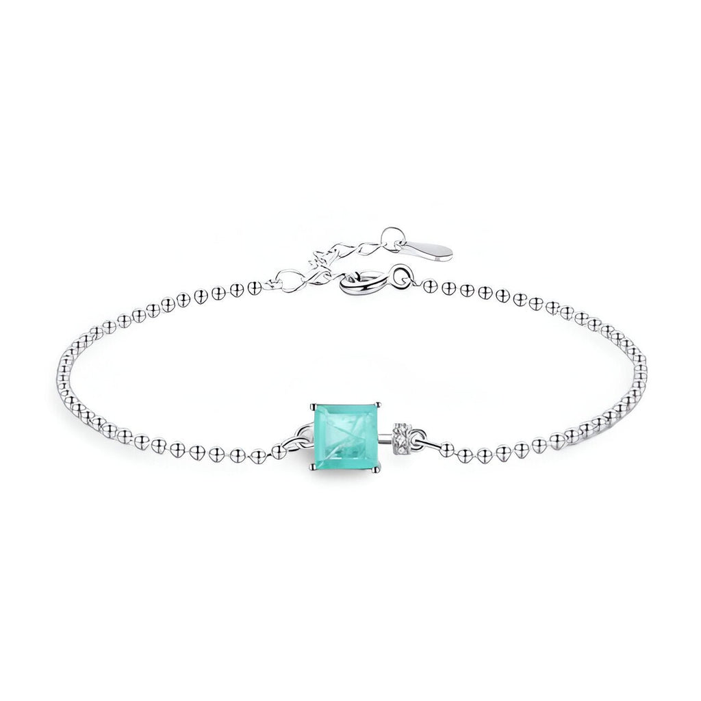 Bracelet en argent sterling avec pierre carrée turquoise sertie sur chaîne fine à billes.