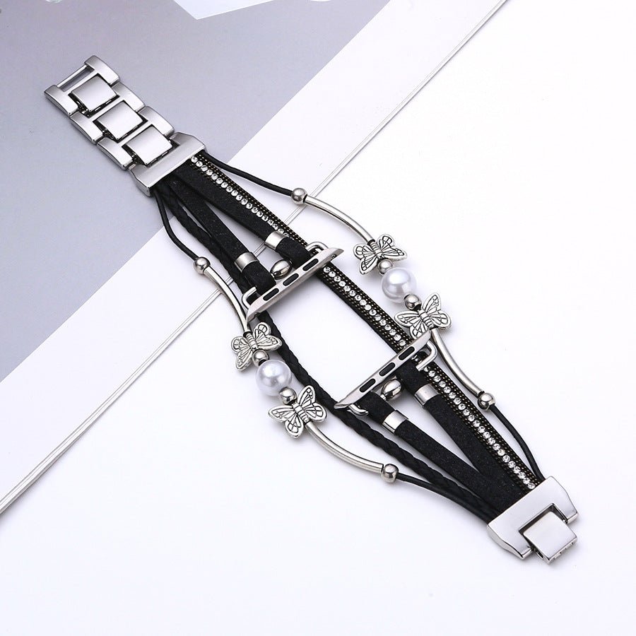 Bracelet Apple Watch multi-brins cuir noir, perles blanches, papillons argentés, fermoir métallique argent élégant.