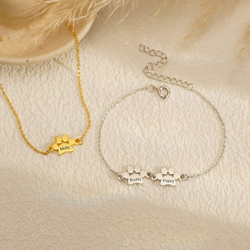 Bracelet fin en acier inoxydable or avec pendentif patte personnalisée et bracelet argenté avec trois pendentifs pattes.