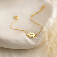 Bracelet doré en acier avec pendentif patte personnalisée gravée "Molly".