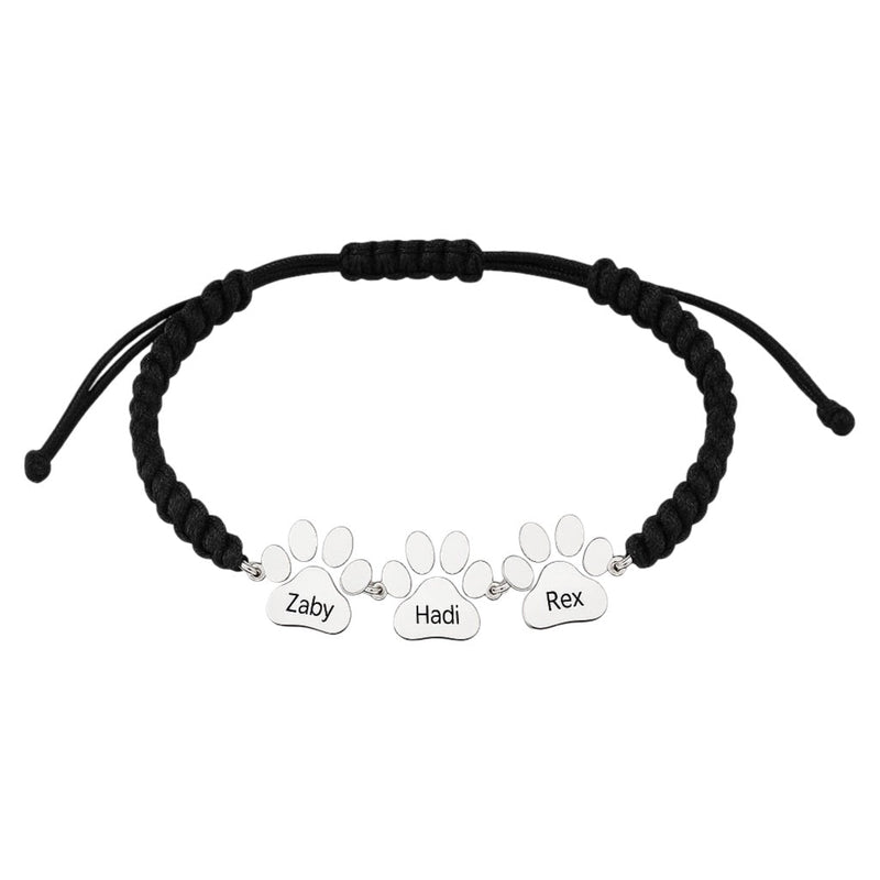 Bracelet en nylon noir ajustable avec trois pendentifs patte en acier inoxydable gravés Zaby, Hadi, Rex.