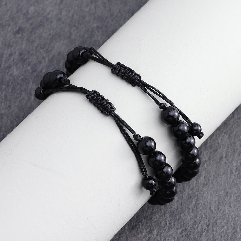 Bracelet ajustable en cordon noir avec perles en obsidienne noire et plaque rectangulaire acier inoxydable personnalisable.