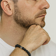 Bracelet élastique perles noires en pierre de lave avec symboles astrologiques métalliques argentés, style masculin et.