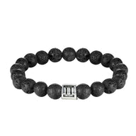 Bracelet élastique perles rondes en pierre de lave noire avec un charme astucieux en métal argenté motif signe astrologique.
