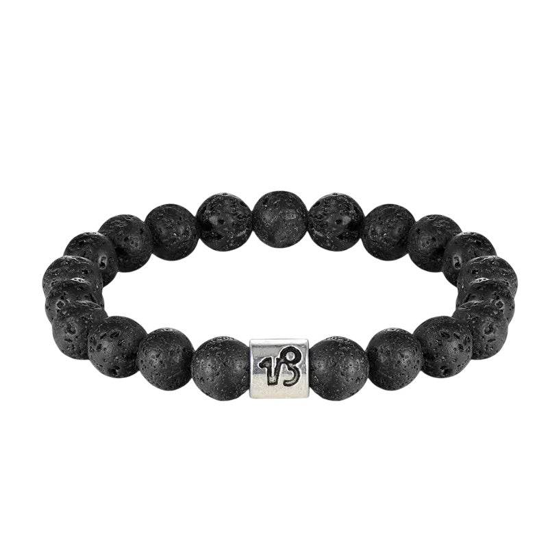 Bracelet élastique perles rondes en pierre de lave noire avec un cube argenté gravé du symbole astrologique du zodiaque.