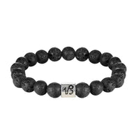 Bracelet élastique perles rondes en pierre de lave noire avec un cube argenté gravé du symbole astrologique du zodiaque.