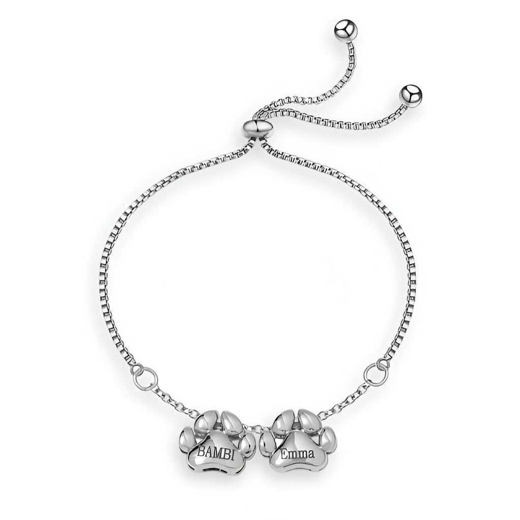 Bracelet fin en acier inoxydable argenté avec pendentifs pattes gravés "Bambi" et chaîne ajustable à coulisse.