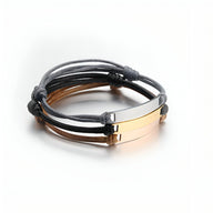 Bracelet Spotify personnalisé avec cordes noires et marron, plaques en acier inoxydable noir et or rosé.