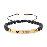 Bracelet Térique pierres noires avec plaque métal doré personnalisée motif Spotify.