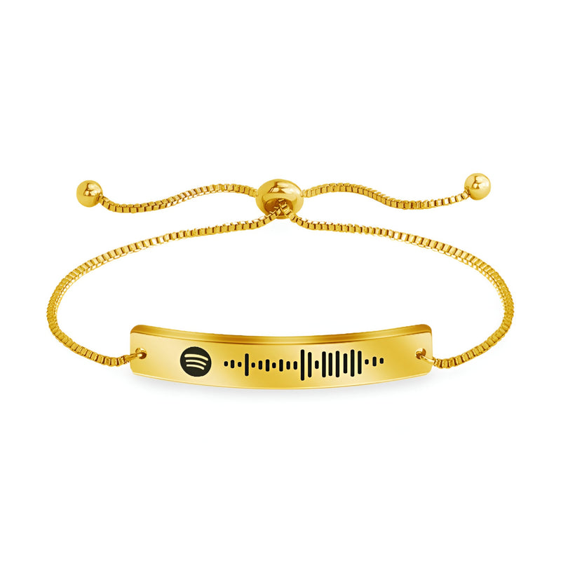 Bracelet gourmette ajustable en métal doré avec code Spotify gravé et fermoir coulissant.
