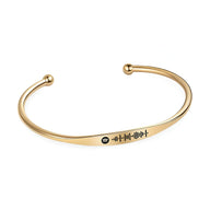 Bracelet jonc en acier inoxydable or avec code Spotify gravé noir et extrémités sphériques.